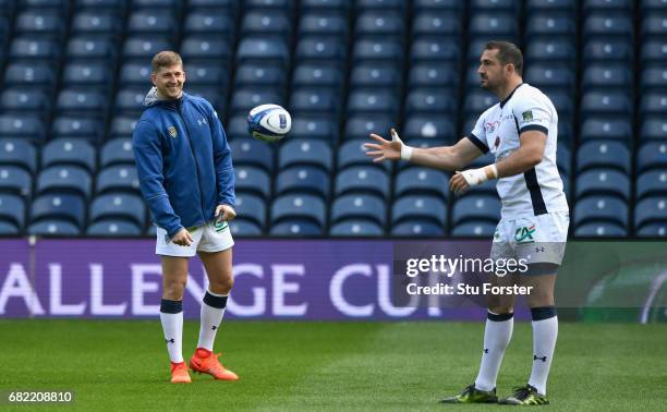 Clermont Auvergne wing David Strettle shares a joke with Scott Spedding during the captains run before the 2017 European Rugby Champions Cup Final at...