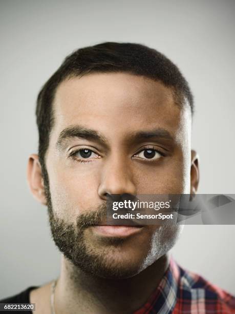 two faced man against gray background - multiculturalism faces stock pictures, royalty-free photos & images