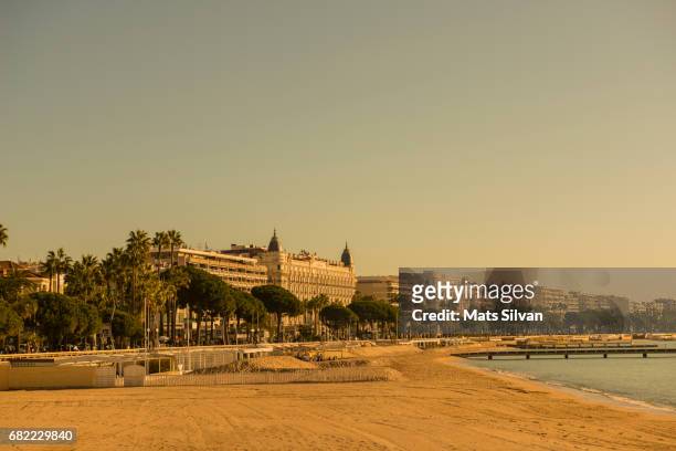 beach and the sea with city view in cannes - cannes beach stock pictures, royalty-free photos & images