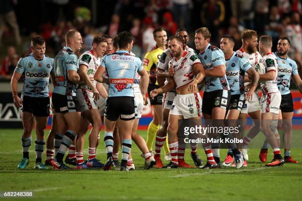 Players scuffle during the round 10 NRL match between the St George Illawarra Dragons and the Cronulla Sharks at UOW Jubilee Oval on May 12, 2017 in...