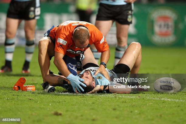 Jack Bird of the Sharks receieves attention from the trainer during the round 10 NRL match between the St George Illawarra Dragons and the Cronulla...