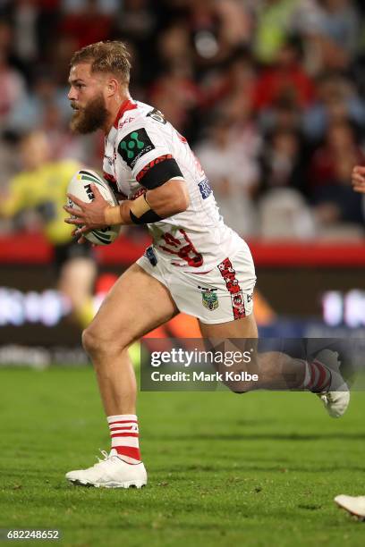 Jack de Belin of the Dragons runs the ball during the round 10 NRL match between the St George Illawarra Dragons and the Cronulla Sharks at UOW...