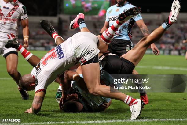 Gerard Beale of the Sharks is tackled short of the line during the round 10 NRL match between the St George Illawarra Dragons and the Cronulla Sharks...