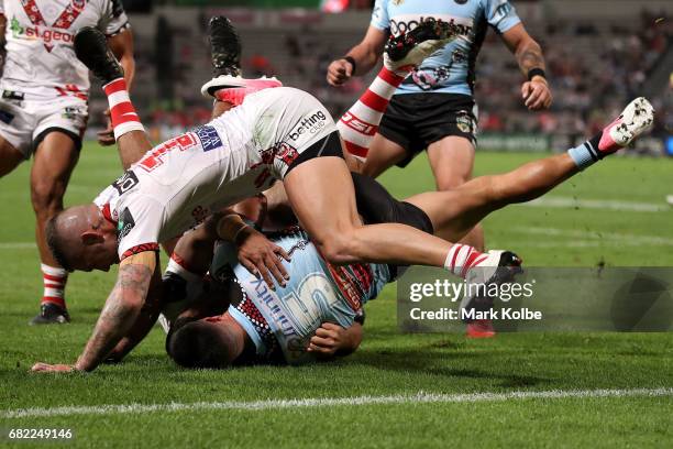 Gerard Beale of the Sharks is tackled short of the line during the round 10 NRL match between the St George Illawarra Dragons and the Cronulla Sharks...