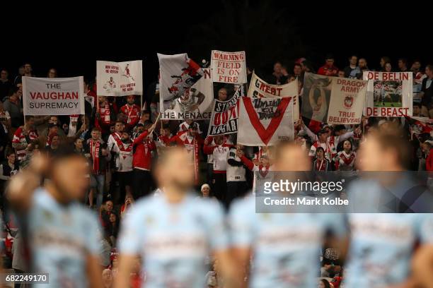 Dragons supporters cheer during the round 10 NRL match between the St George Illawarra Dragons and the Cronulla Sharks at UOW Jubilee Oval on May 12,...