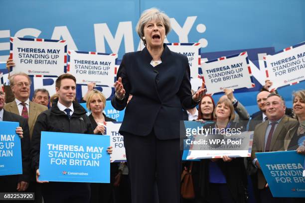 United Kingdom Prime Minister, Theresa May, speaks to party supporters in front of the Conservative party's general election campaign "battle bus" at...