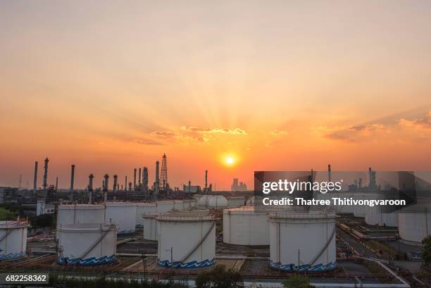 oil and gas industry refinery at sunset - oil industry stock-fotos und bilder