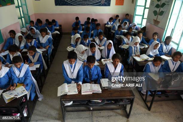 In this photograph taken on May 11 former Pakistani child labourers attend a class at a school on the outskirts of Lahore, following a scheme that...