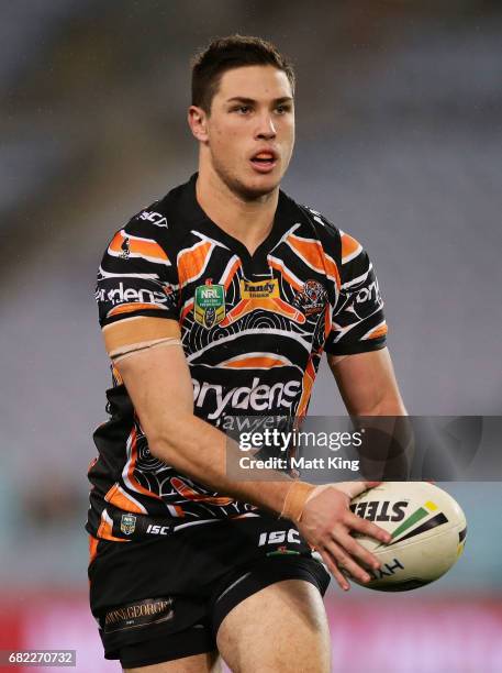 Mitchell Moses of the Tigers runs with the ball during the round ten NRL match between the Wests Tigers and the South Sydney Rabbitohs at ANZ Stadium...