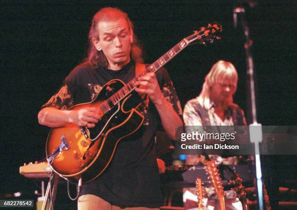 Steve Howe and Rick Wakeman of Yes performing on stage on their reunion tour, Canada, April 1991.