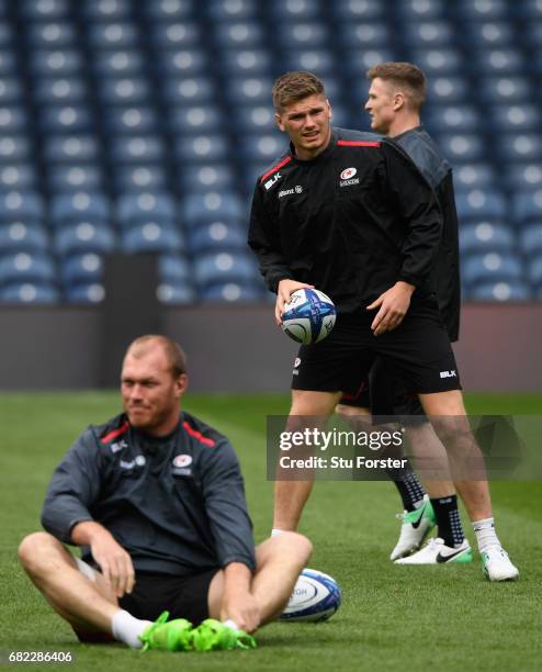 Saracens player Owen Farrell warms up during the captains run before the 2017 European Rugby Champions Cup Final at Murrayfield Stadium on May 12,...