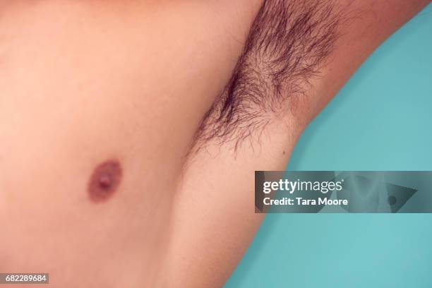 close up of man's armpit - smelling armpit stock pictures, royalty-free photos & images