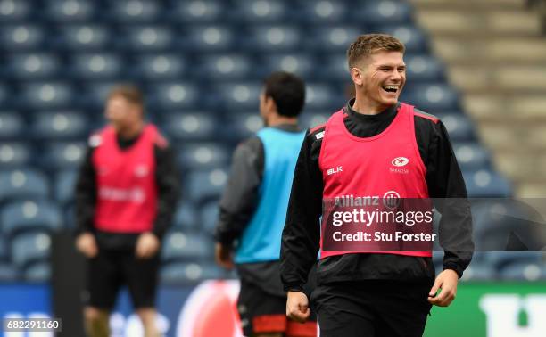 Saracens player Owen Farrell shares a joke during the captains run before the 2017 European Rugby Champions Cup Final at Murrayfield Stadium on May...