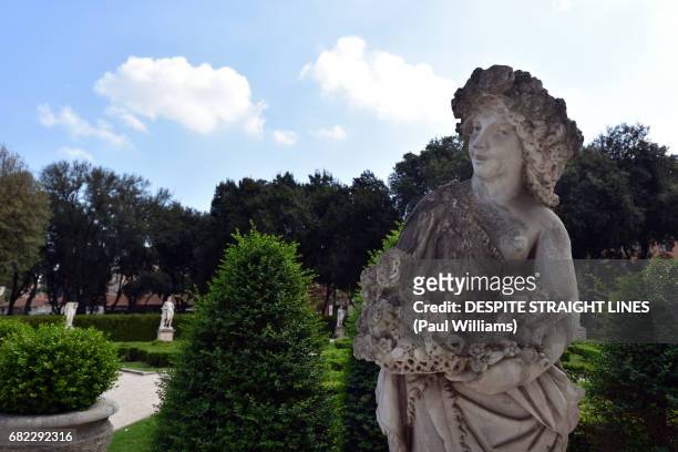 a white marble statue in the gardens of villa borghese, rome - marble sculpture stock pictures, royalty-free photos & images