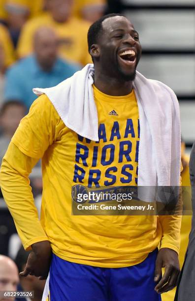 Draymond Green of the Golden State Warriors laughs on the sideline against the Utah Jazz in Game Three of the Western Conference Semifinals during...