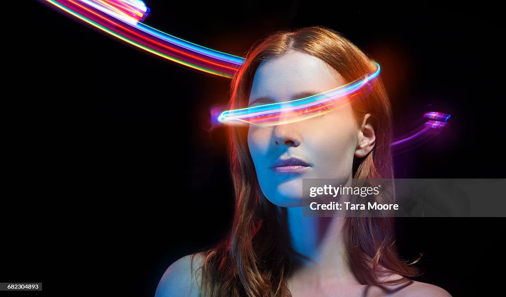 Portrait of woman with light trails