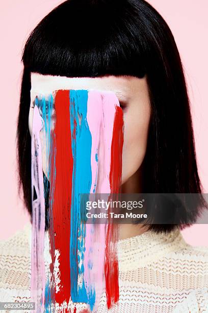 portrait of woman with paint on face - no face ストックフォトと画像