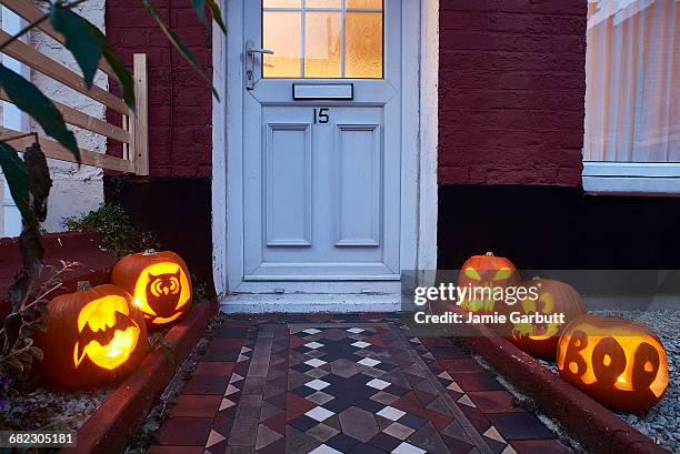 pumpkins lining a path way to a house - house door stock pictures, royalty-free photos & images