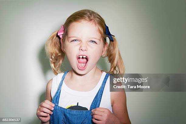 young girl shouting to camera - six girl stock-fotos und bilder