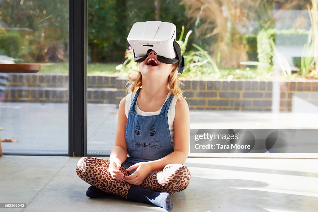 Young girl using virtual reality headset