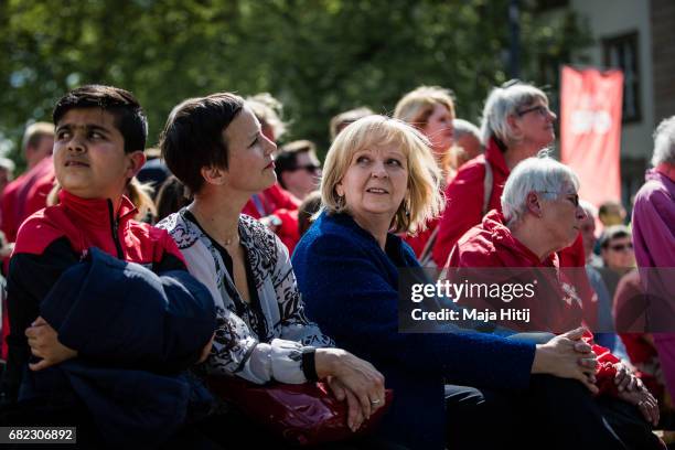 German Social Democrats lead candidate Hannelore Kraft sits next to supporters at the final SPD campaign rally in state elections in North...