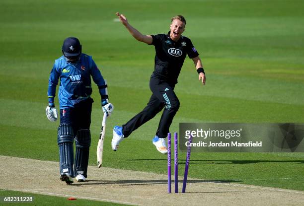 Tom Curran of Surrey celebrates dismissing Daniel Bell-Drummond of Kent during the Royal London One-Day Cup match between Surrey and Kent at The Kia...