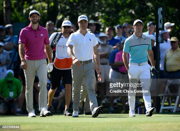 Dustin Johnson, Justin Thomas and Rory McIlroy of Northern Ireland tees off on the 15th hole during the second round of THE PLAYERS Championship on...