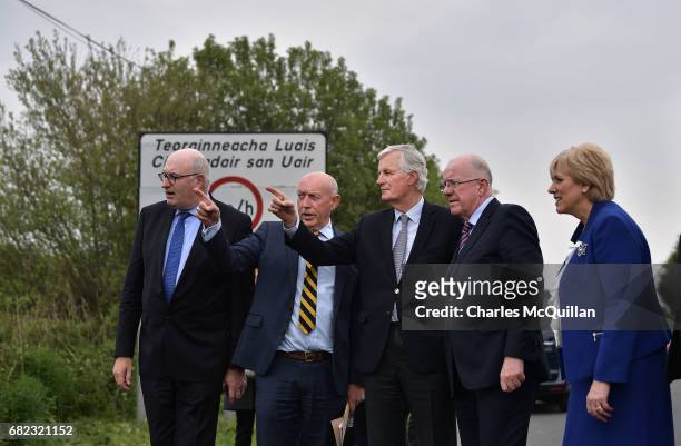 The European Commission Brexit chief negotiator Michel Barnier points towards the north as he is accompanied by Irish Foreign Affairs Minister,...