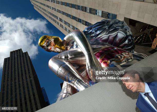 Artist Jeff Koons unveils seated ballerina inflatable sculpture at Rockefeller Center on May 12, 2017 in New York City.