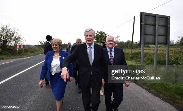 The European Commission Brexit chief negotiator Michel Barnier gestures towards the north as he is accompanied by Irish Foreign Affairs Minister,...