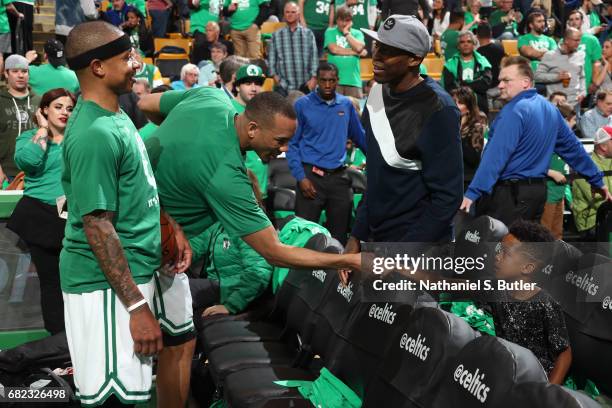 Jamal Crawford of the LA Clippers talk with Isaiah Thomas and Avery Bradley of the Boston Celtics before Game Five of the Eastern Conference...