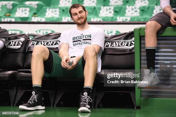 Tyler Zeller of the Boston Celtics smiles on the bench before Game Five of the Eastern Conference Semifinals against the Washington Wizards during...