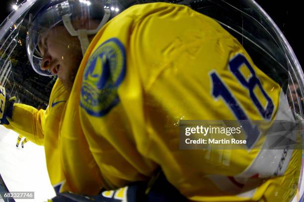 Dennis Everbrg of Sweden slides into the boards during the 2017 IIHF Ice Hockey World Championship game between Sweden and Italy at Lanxess Arena on...