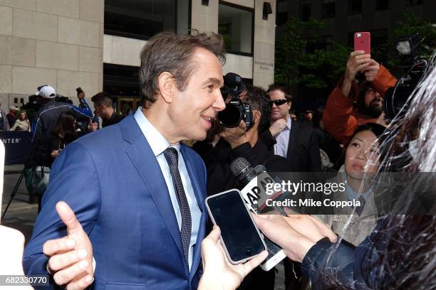 Artist Jeff Koons answers questions after he unveils his seated ballerina inflatable sculpture at Rockefeller Center on May 12, 2017 in New York City.