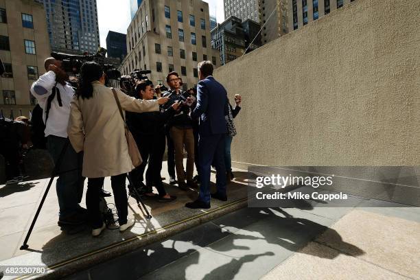 Artist Jeff Koons answers questions after he unveils his seated ballerina inflatable sculpture at Rockefeller Center on May 12, 2017 in New York City.