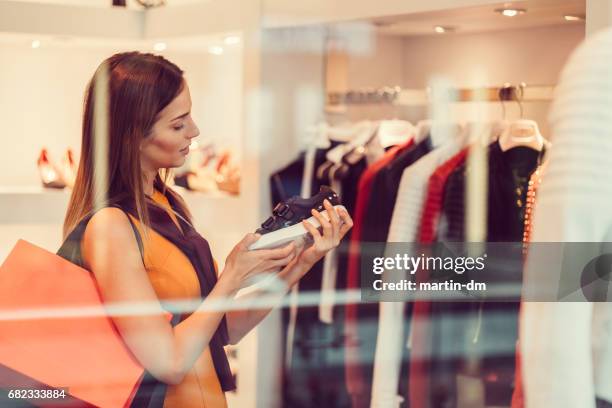 young woman in the shopping mall - shoe shop stock pictures, royalty-free photos & images