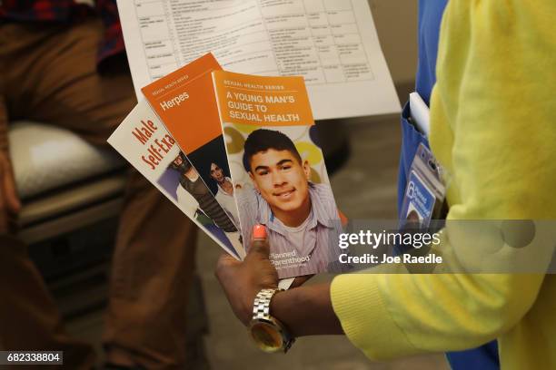 Linda Williams, a medical assistant, brings some STD educational material to a patient at a Planned Parenthood health center on May 12, 2017 in...