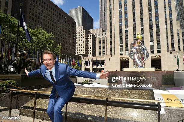 Artist Jeff Koons unveils seated ballerina inflatable sculpture at Rockefeller Center on May 12, 2017 in New York City.