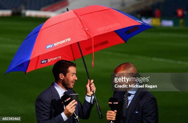 Jamie Redknapp and Thierry Henry speak on the pitch prior to the Premier League match between West Bromwich Albion and Chelsea at The Hawthorns on...