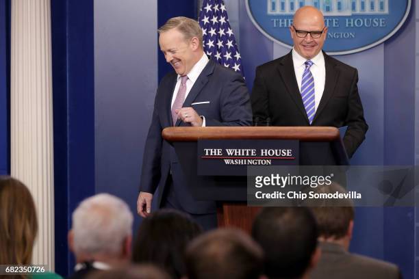 White House Press Secretary Sean Spicer turns the podium over the National Security Advisor H.R. McMaster during the daily news conference in the...