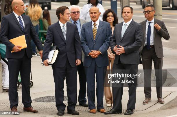 Former Los Angeles County sheriff Lee Baca walks with his wife and attorney's to the U.S. Courthouse in Los Angeles for his scheduled sentencing on...