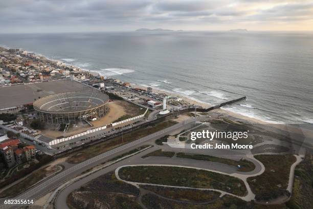 The U.S.-Mexico border fence, seen from above, stretches into the Pacific Ocean on May 11, 2017 in San Diego, California. The fence separates San...