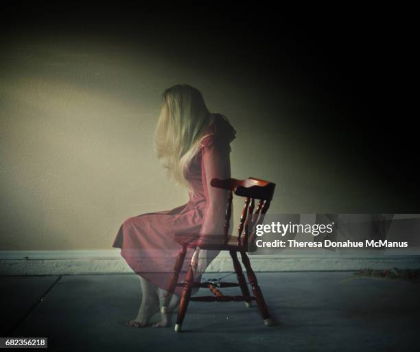 artistic photo of woman in wooden chair - onzichtbaar stockfoto's en -beelden