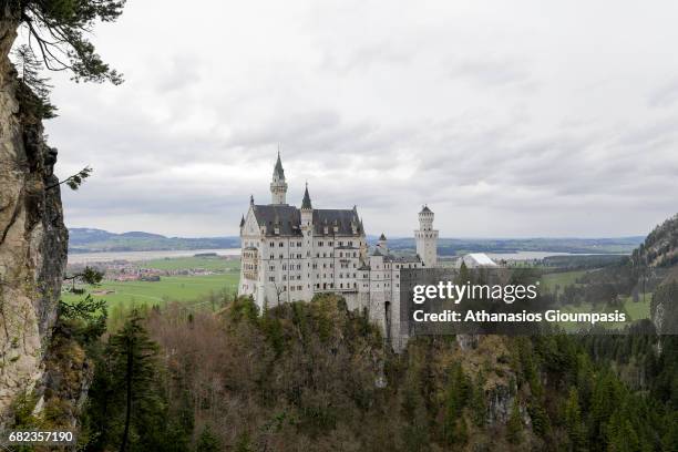 The Neuschwanstein Castle or Schloss Neuschwanstein view from from Marienbruecke the bridge over the Pollat Gorge on April 17, 2017 in Bavaria,...