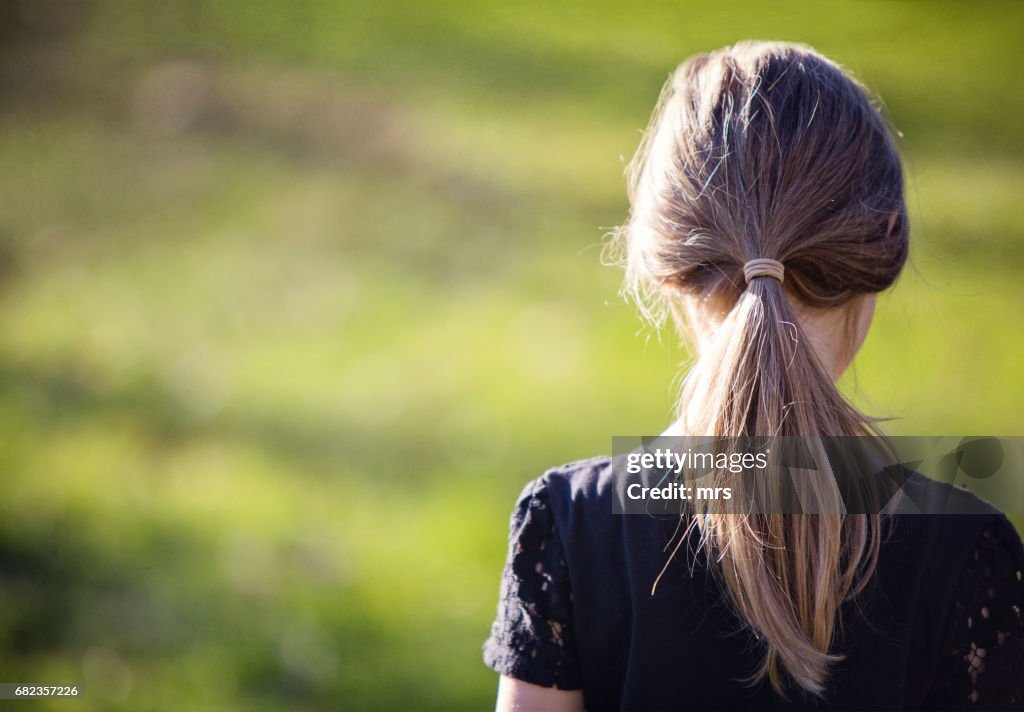 Rear view of girl outdoors