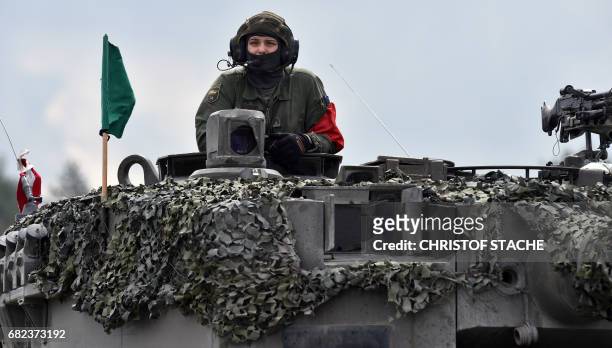 An Austrian soldier arrives with a tank type 'Leopard' prior the friendship shooting of several nations during the exercise 'Strong Europe Tank...