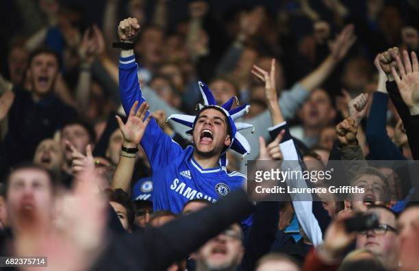 Chelsea fan cheers his team on during the Premier League match between West Bromwich Albion and Chelsea at The Hawthorns on May 12, 2017 in West...