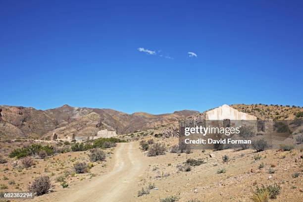 road entrance to the mines of paramillos near mendoza, argentina - argentina dirt road panorama stock pictures, royalty-free photos & images