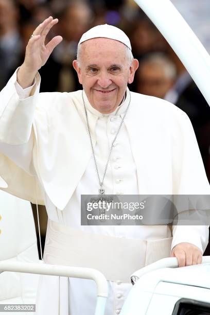 Pope Francis waves to devotees inside the popemobile at the Fatima Sanctuary in Leiria, Portugal, 12 May 2017. Pope Francis will preside over the...