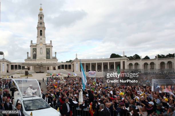 Pope Francis waves to devotees inside the popemobile at the Fatima Sanctuary in Leiria, Portugal, 12 May 2017. Pope Francis will preside over the...